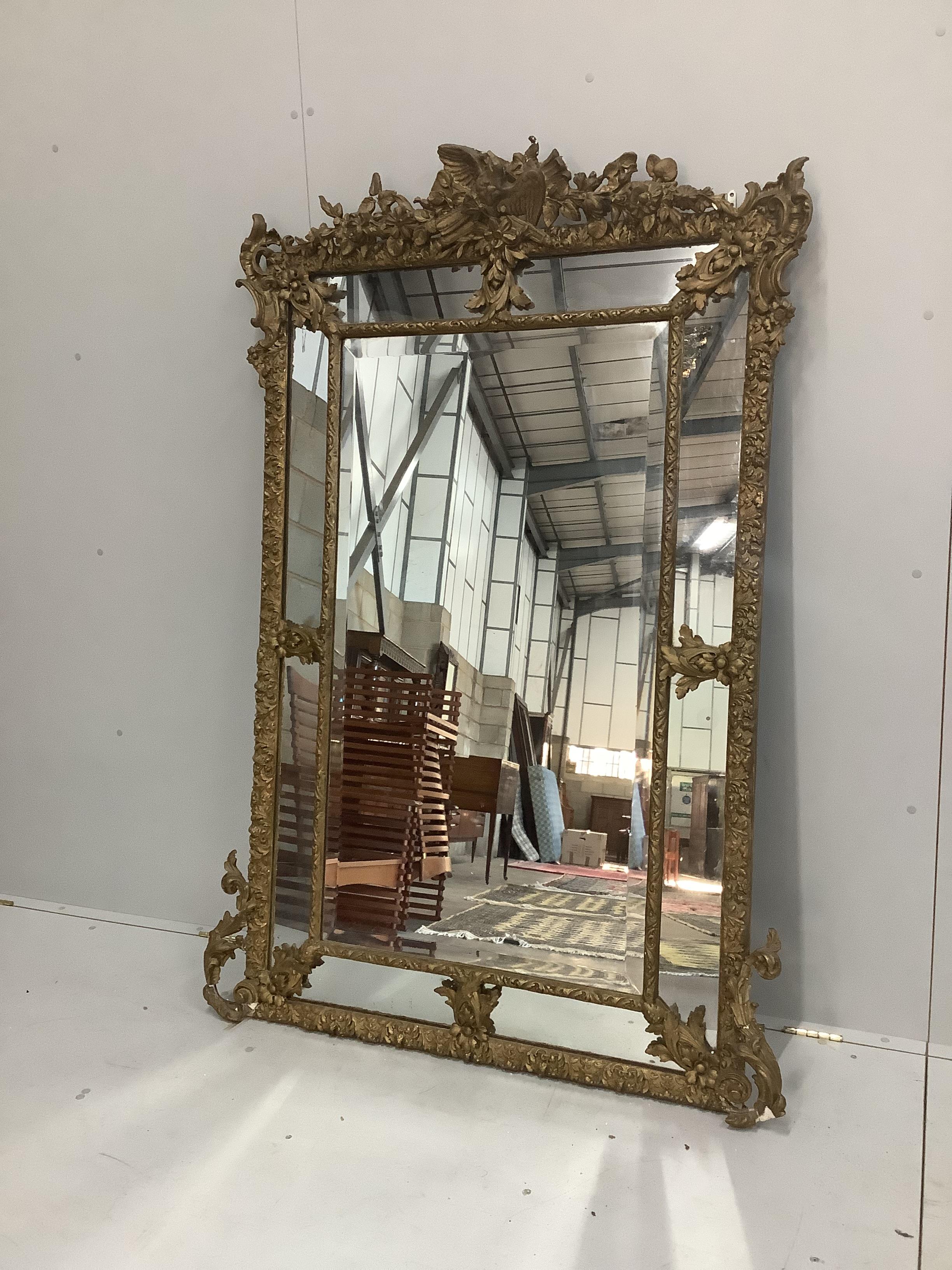 A late 19th century French gilt gesso wall mirror, width 118cm, height 170cm